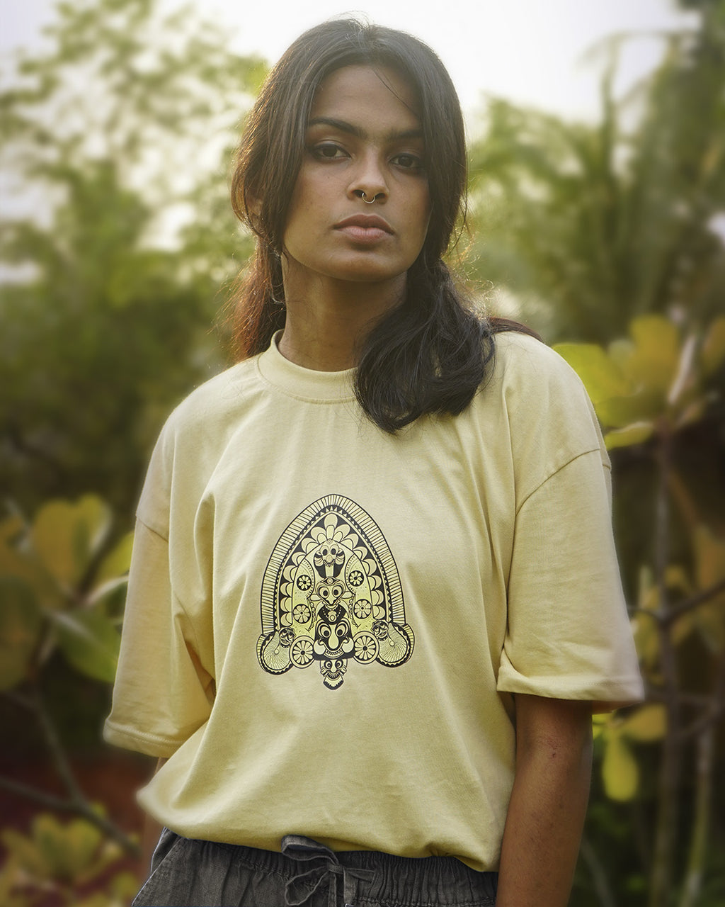 Padayani, a ritual folk art form practiced in central Kerala, is a spectacular blend of song, dance, satire, and theatre.  The most striking visual feature of each Padayani is the tall totemic mask that is handcrafted using areca palm leaf sheaths and painted with natural pigments. The design was originally handcrafted by our artist.